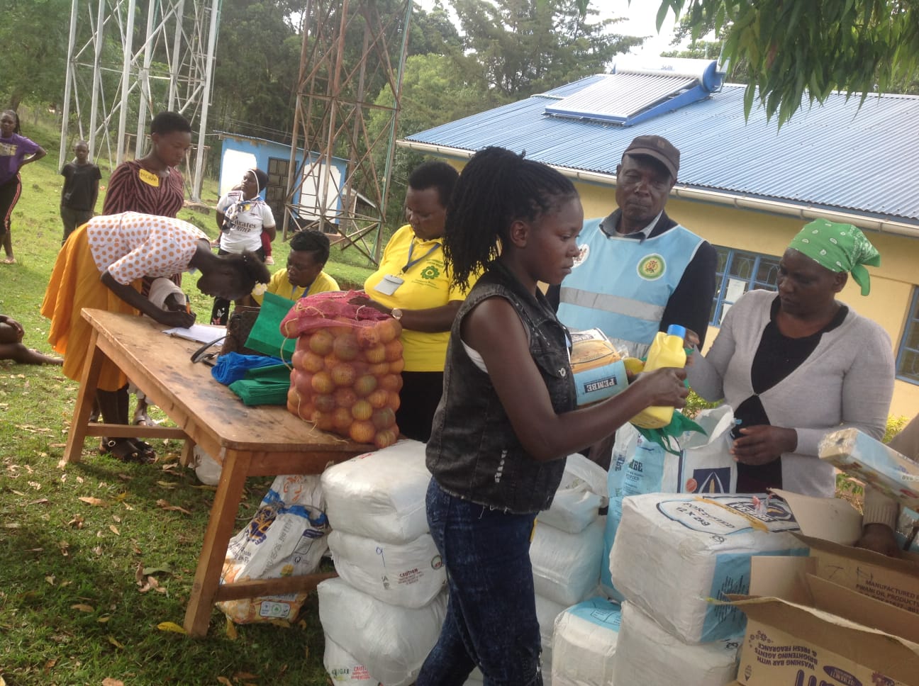 A teen mother excited as she receives basic items from HFAW