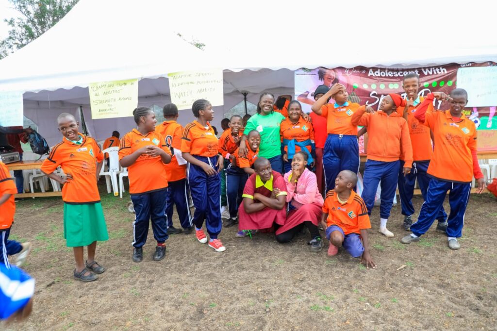 A photo of the pupils with disability alongside HFAW staff